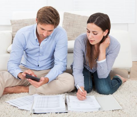 Young couple working on finances