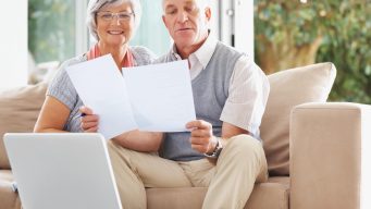 Senior Couple Reading Document - IVA and PPI
